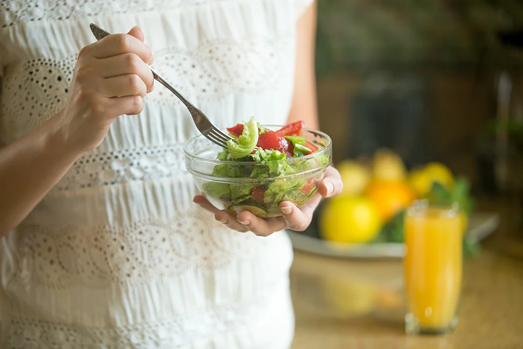 hand-holding-bowl-with-salad-fork-another